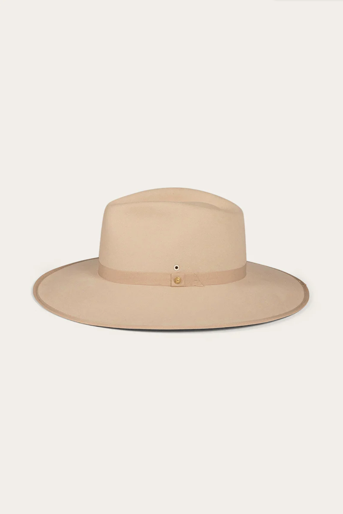 The Ringers Western Woodford Hat is a beige wide-brimmed fedora made from premium felt, with a matching grosgrain ribbon and small buckle, radiating its charm against a plain white background.