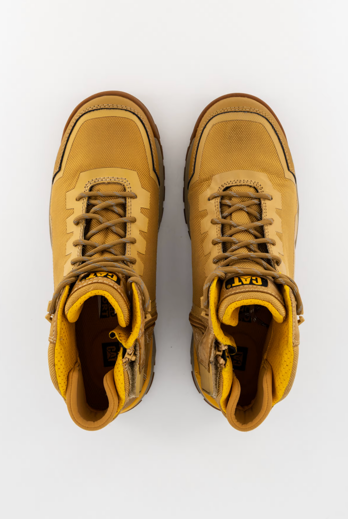 A pair of yellow CAT Propulsion CT Zip Work Boots with brown laces, rugged soles, and a comfort footbed, shown from above. These slip-resistant boots are placed side by side on a white background.