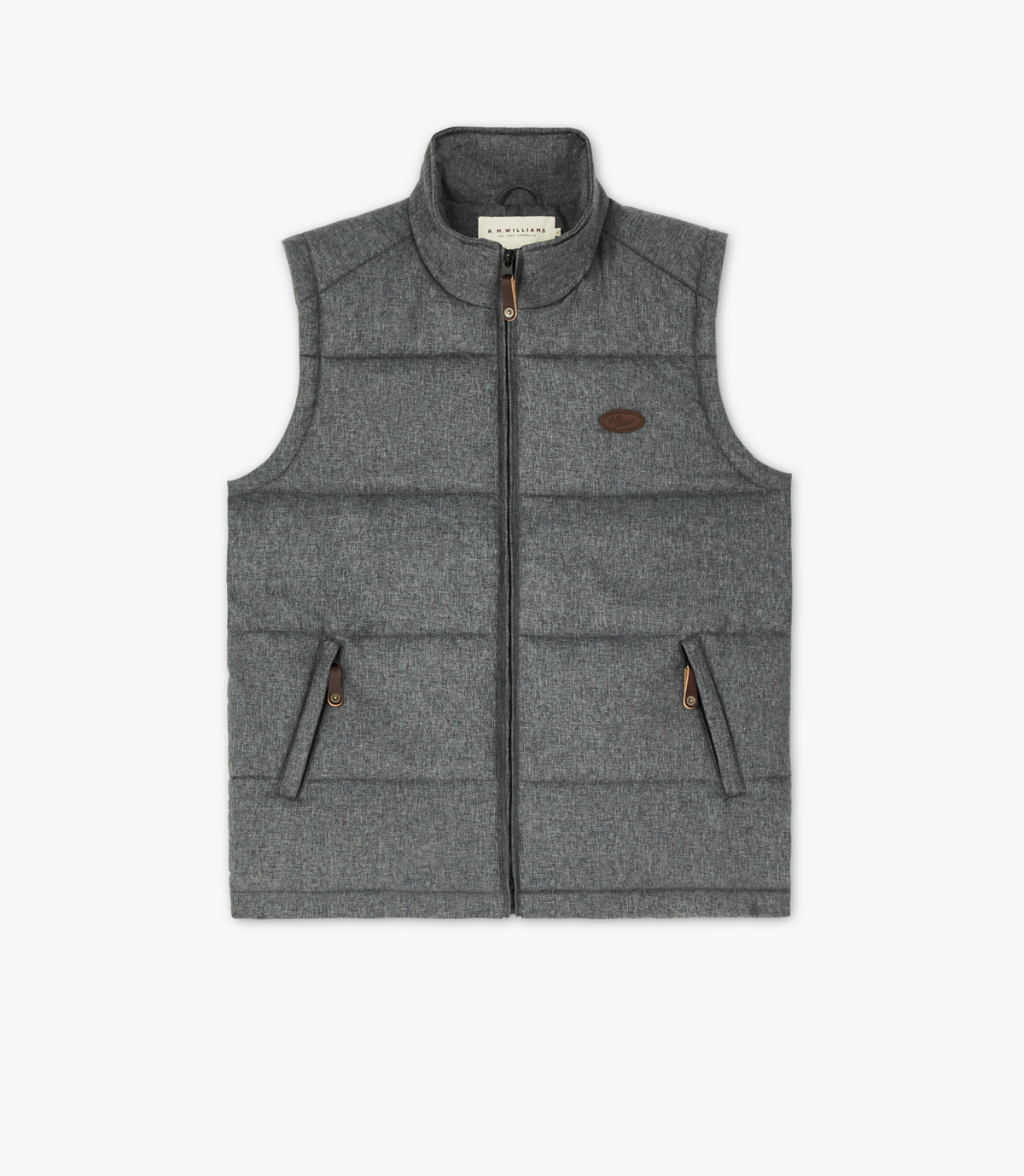 The RM Williams Patterson Creek Vest is a gray, sleeveless quilted puffer with a full zip front and two zippered pockets. It features a chest leather patch, branded collar label, textured look, adjustable drawstring hem, and is water-resistant. Displayed on a plain white background.