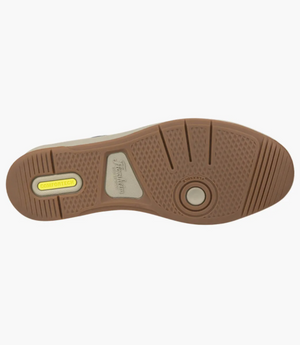 The image shows the Florsheim Crossover Knit shoe sole with a brown rubber tread and circular texture. A COMFORTECH label indicates its cushioned footbed for comfort, while the "Florsheim" brand name embossed in the center enhances breathability.