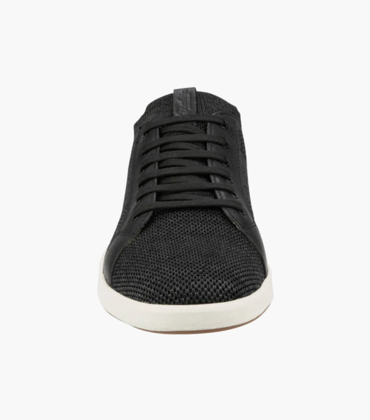 Front view of the Florsheim Crossover Knit, a black lace-up shoe featuring a textured fabric upper, cushioned footbed, and white rubber outsole, set against a white background.