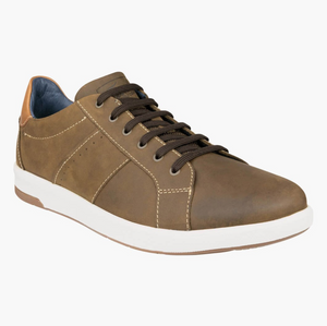 The Florsheim Crossover Lace Sneaker features a brown leather upper with dark brown laces and white stitching. Its slip-resistant rubber sole provides stability, while the low-top design and tan heel accent enhance its stylish functionality.