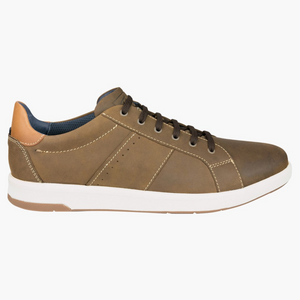 The Florsheim Crossover Lace Sneaker boasts a brown leather upper with a tan heel accent, black laces, and white stitching. Its sleek low-top design features a slip-resistant rubber sole, ideal for everyday wear.