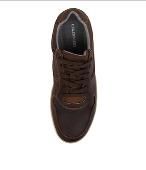 The Colorado Eiko Leather Sneaker features an oiled leather upper with dark brown laces and stitching. A padded collar enhances comfort, and "COLORADO" is displayed on the insole. The light-colored sole with a rubber grip outsole contrasts strikingly with the top view of this leather sneaker.