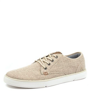 The Colorado Albatross Canvas Sneaker, showcased against a white background, is a beige wide-fit design featuring metal eyelets, a subtle upper fabric texture, white rubber soles, and a memory foam inner sole for enhanced comfort.