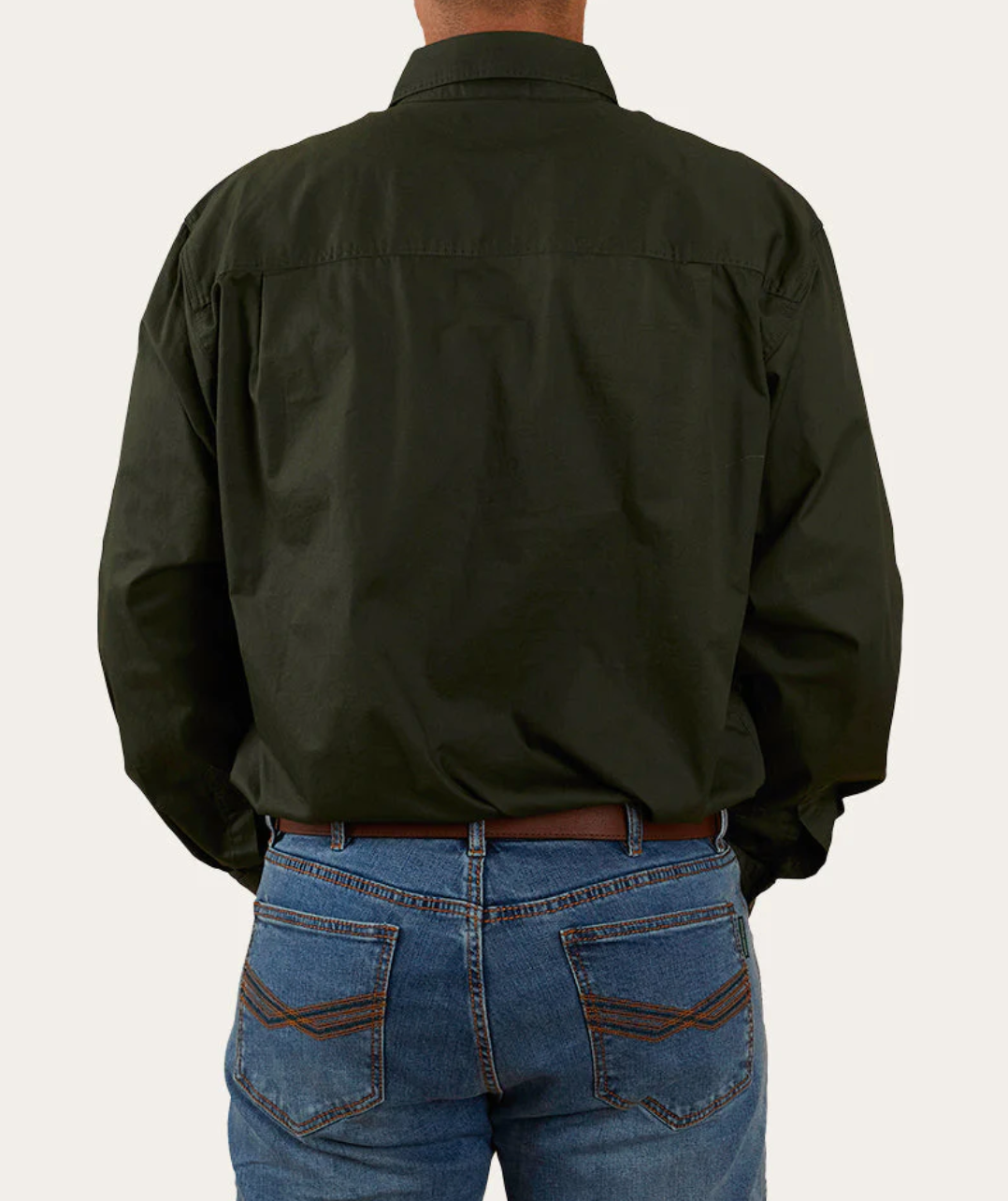 A person wearing a dark green Ringers Western King River Half Button Shirt and blue jeans stands with their back to the camera against a plain background. The 100% cotton shirt is untucked, and their hands are relaxed by their sides, exuding the vibe of a comfortable work shirt.