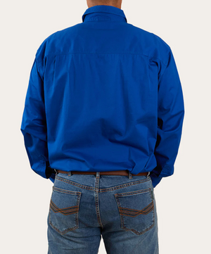 A person in a bright blue Ringers Western King River Half Button long-sleeve work shirt and cotton blue jeans stands with their back to the camera, shirt neatly tucked into the jeans, against a plain white background.