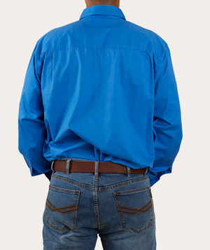 A person stands with their back to the camera, wearing a Ringers Western King River Half Button Shirt in bright blue, made of 100% cotton, paired with blue jeans featuring brown stitching.