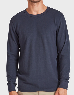 Against a plain white background, a person is shown from shoulders to hips wearing the Academy Brand Workers Crew, a dark blue long-sleeve shirt with a classic crew neck and comfortable standard fit.