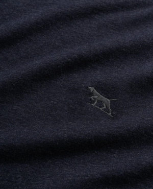 The Rodd & Gunn Long Sleeve Gunn T-Shirt is a dark blue, 100% cotton fabric with a subtle texture in a sports fit. It features an embroidered silhouette of a small dog, standing and facing left, on the lower right side.