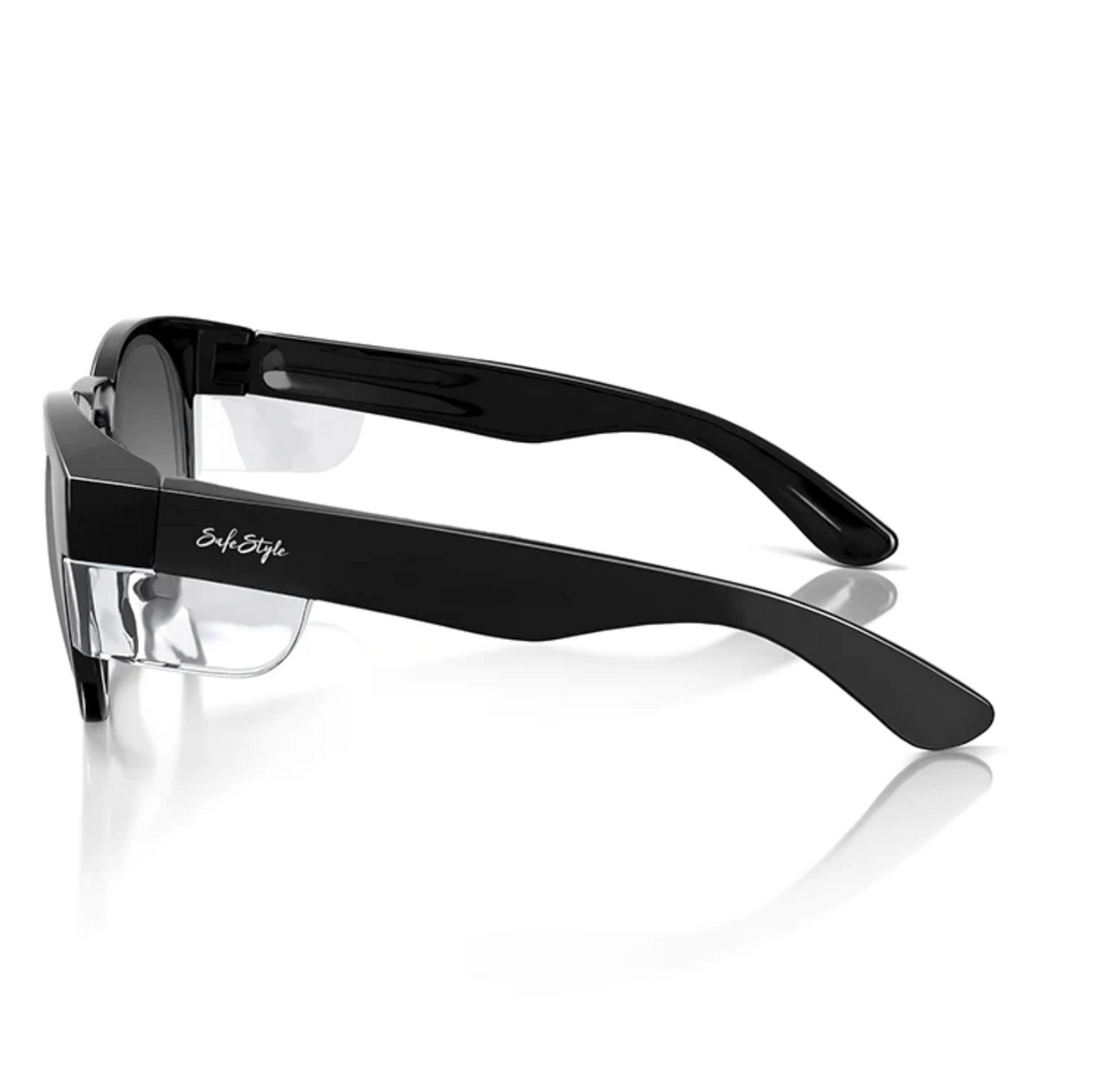 Side view of SafeStyle Cruisers: black thick-frame glasses with a clear nose bridge and UV-protected, slightly angled tinted lenses. A small temple logo complements the glossy finish, highlighting their modern style.