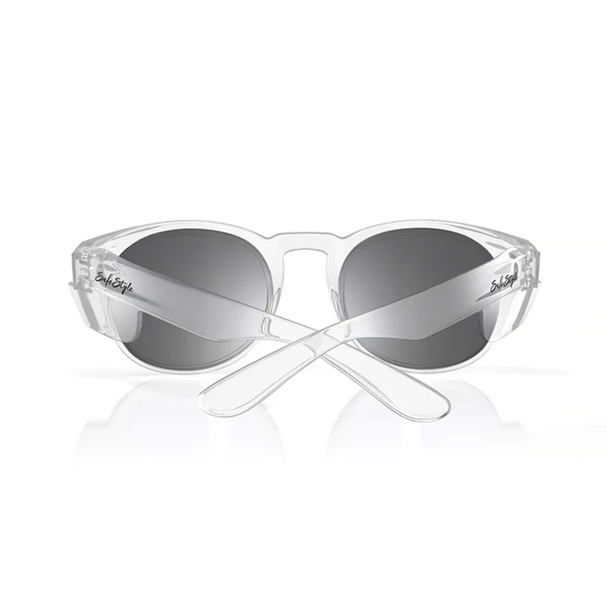 The SafeStyle Cruisers feature clear frames and tinted lenses with a reflective finish viewable from the front. The crossed arms showcase a signature on one side, offering UV protection while contrasting elegantly with the transparent frame.