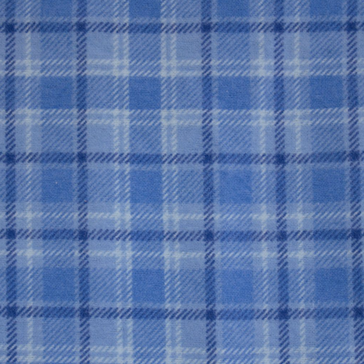 The Contare Country Winter Flannelette PJ Set features a blue and light blue tartan plaid pattern in soft brushed cotton, offering lasting comfort and warmth with a stylish checkered design.