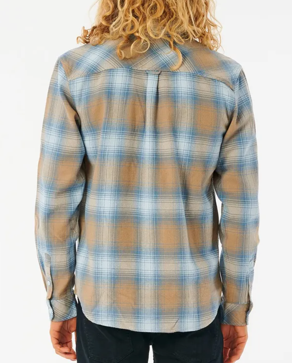 Person with long, wavy blonde hair in a Rip Curl Count Flannel Shirt, blue and beige plaid. The brushed cotton shirt has long sleeves and is paired with dark pants against a plain white background, viewed from the back.