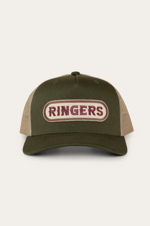 The Ringers Western Jaxton Trucker Cap features a two-tone look with a green cotton twill front, beige mesh back, and an oval patch that reads "RINGERS" in bold red on cream, capturing the rugged essence of the brand.