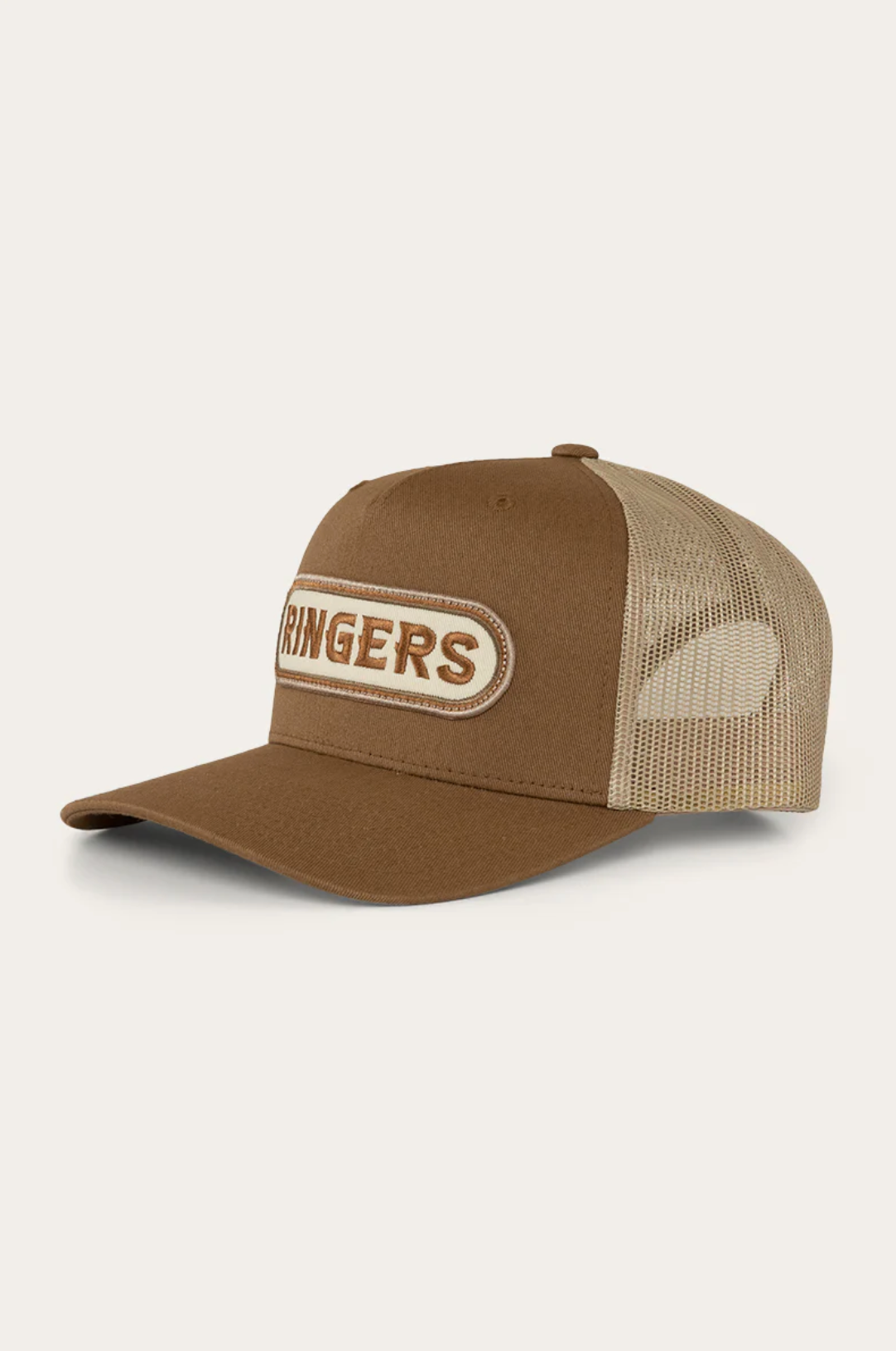 The Ringers Western Jaxton Trucker Cap is a brown hat with a mesh back, beige cotton twill front panel, and an oval patch displaying "RINGERS," showcasing authentic Ringers Western style.