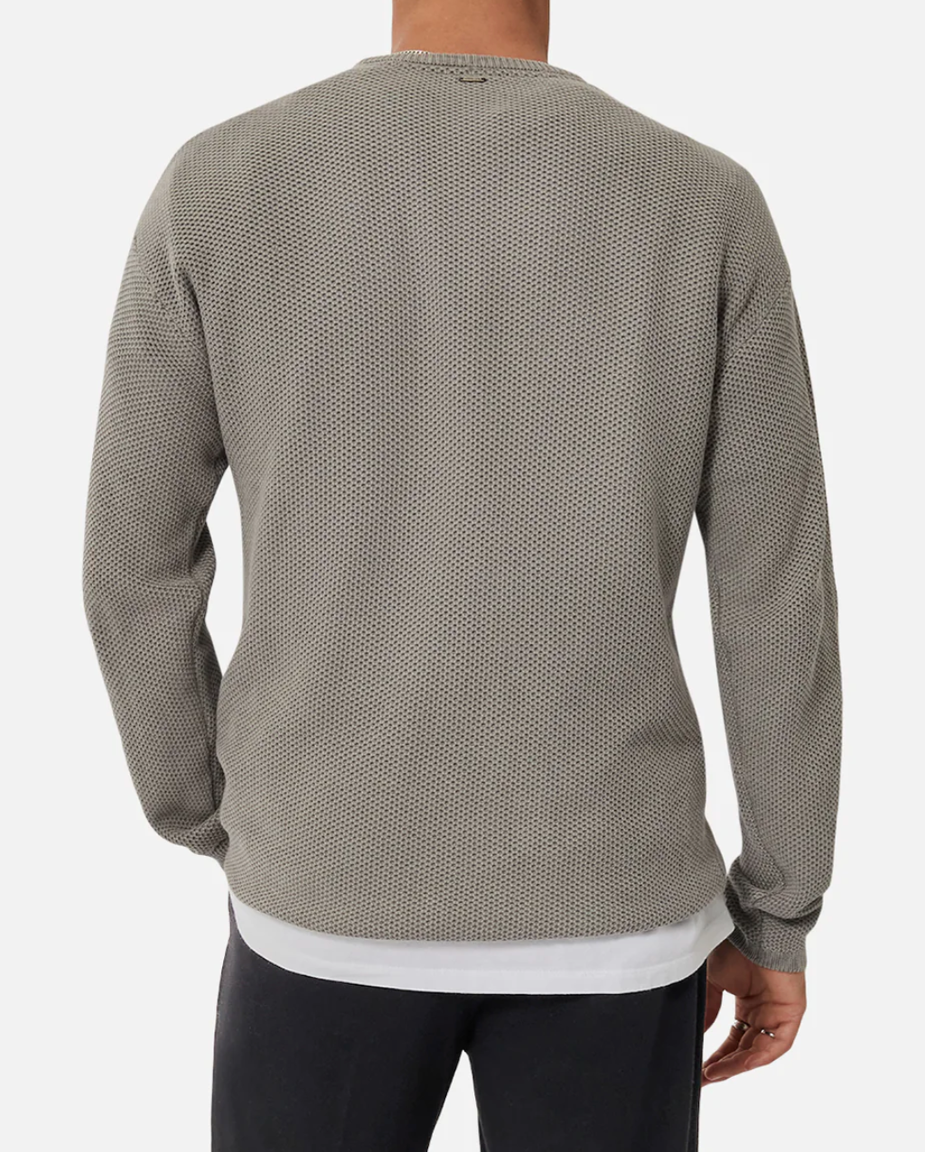A person seen from behind wears the Industrie The Washed Culver Knit, a grey textured, long-sleeve shirt over a 100% cotton white t-shirt, paired with dark pants. The comfortable outfit is showcased against a plain white background.