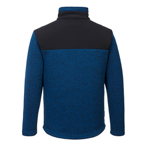 The Portwest KX3 Performance Fleece is displayed from the back, showcasing its comfortable design. This blue and black fleece features a high collar, long sleeves, and a black upper section across the shoulders. The majority of the garment is made from blue textured fabric, ensuring both style and durability.