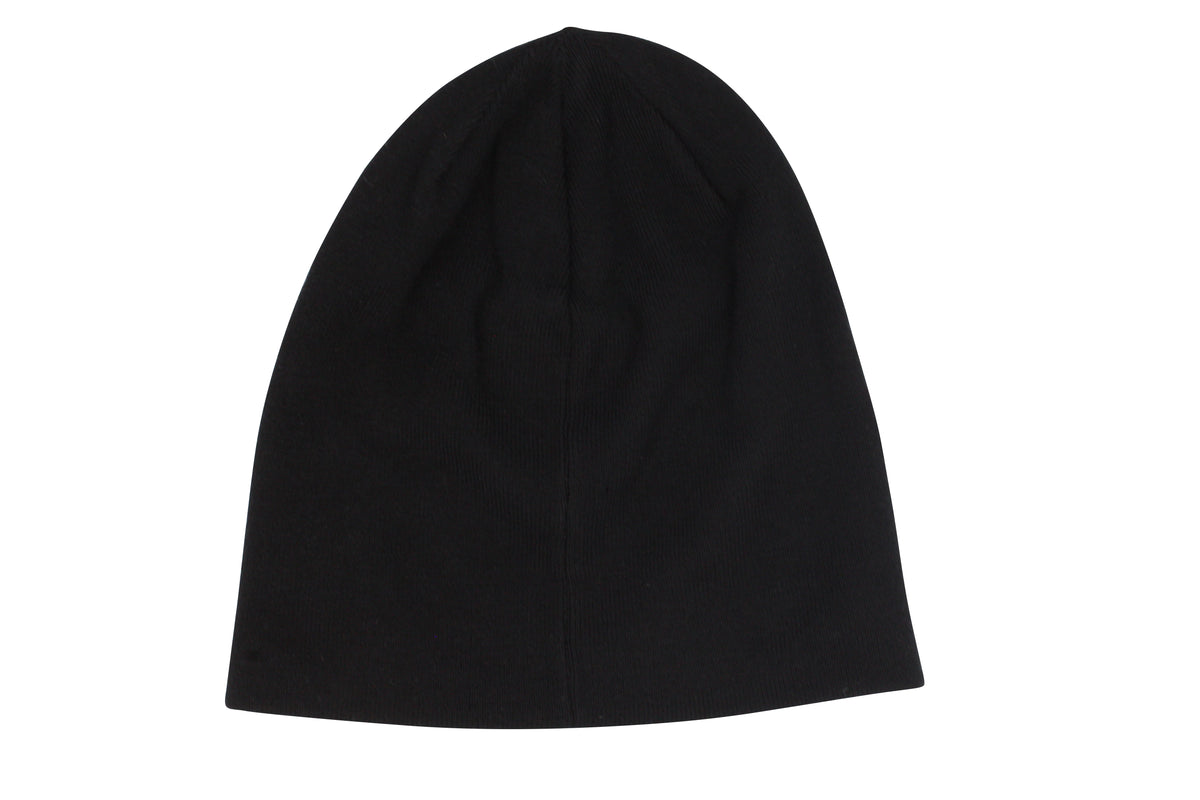 The Rip Curl T-Street Skull Beanie, plain and black with a smooth texture, showcases a subtle roll cuff. Displayed on a white background, it offers effortless style without visible logos or patterns.