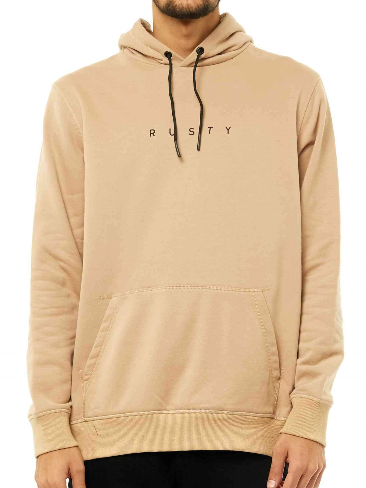 A person wears the Rusty Short Cut Hooded Fleece in beige, featuring a front pocket, black drawstrings, and small black "RUSTY" lettering across the chest, standing out against a plain white background.