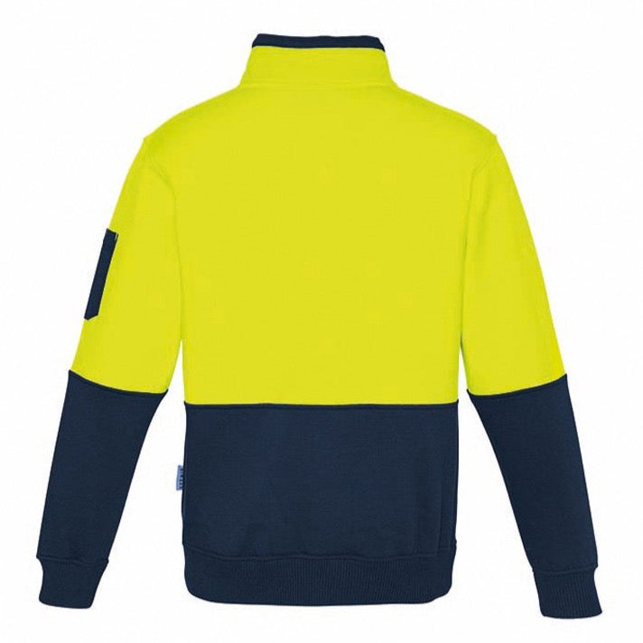 The Syzmik Hi Vis Half Zip Pullover features a bright yellow upper section and a dark navy blue lower section and sleeves. This comfortable pullover includes a stand-up collar, a left arm patch pocket, and ribbed cuffs at the wrists and waistband. The jacket is displayed from the back.
