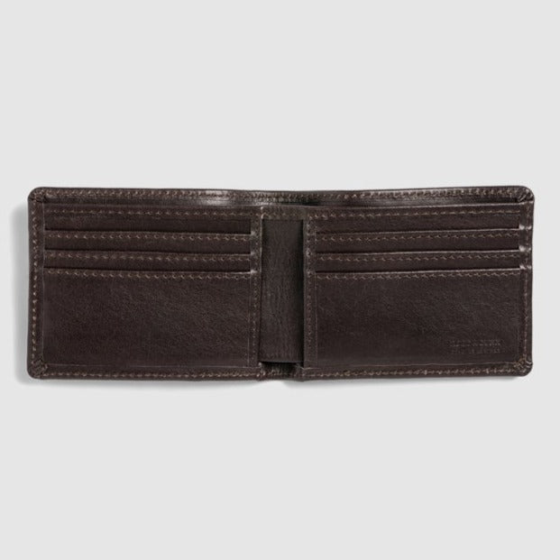 The Rodd & Gunn Victoria Flats Road Wallet is an open, brown leather bifold featuring multiple card slots on both sides and a spacious bill compartment in the middle, crafted from Genuine Buffalo Leather and displayed against a plain white background.