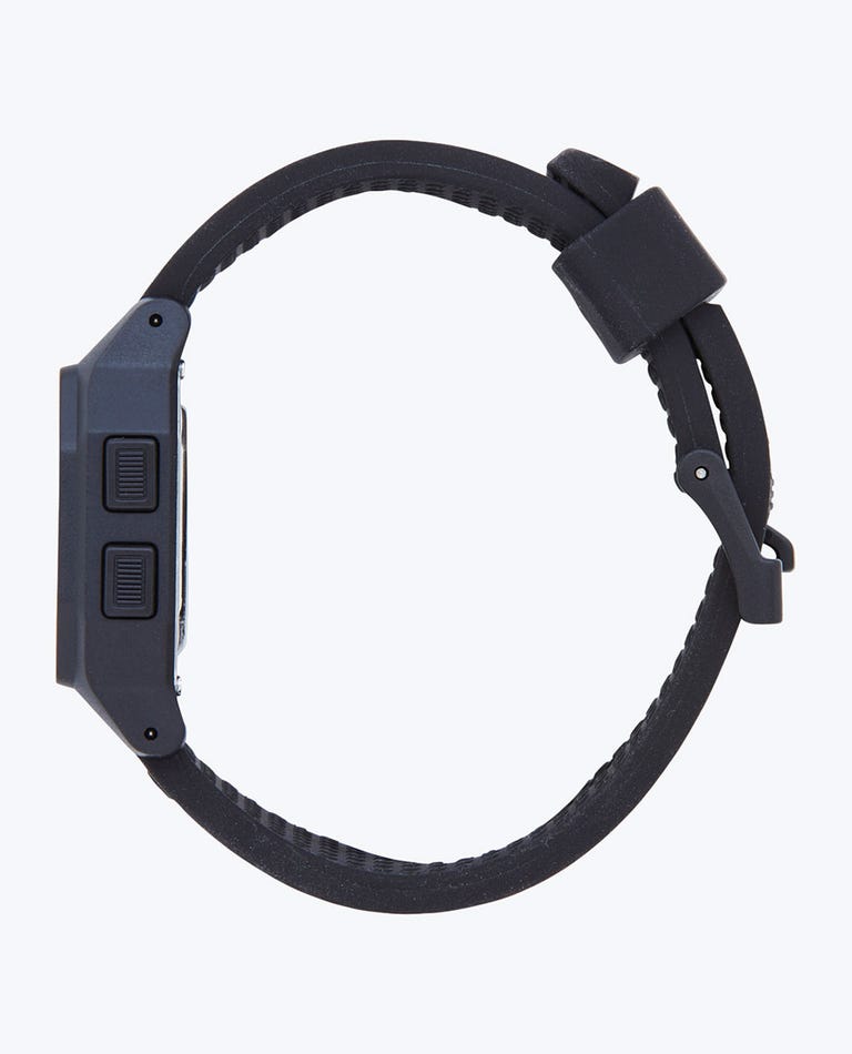 Side view of the Rip Curl Atom Digital Watch with a textured rubber strap and two buttons on the left side of its rectangular, waterproof digital face.