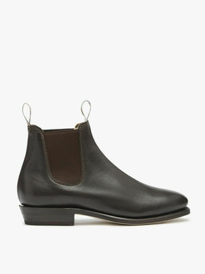 The RM Williams Adelaide Kangaroo Boot features black kangaroo leather, dark elastic side panels, white front and back pull tabs, and a low heel. Shown as a single boot inspired by Classic Adelaide Boots against a white background.