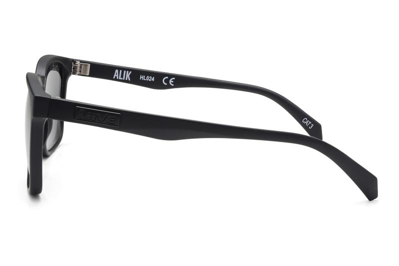 Side view of black rectangular Liive Alik Sunglasses with thick polycarbonate frames. Inside the left temple arm is marked "ALIK" and model details, fitted with optically correct lenses that provide UV protection.