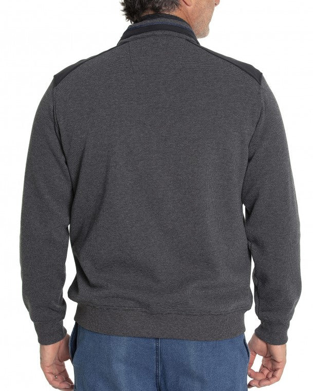 A man is wearing the Breakaway Ryan Jacket, a stylish dark gray long-sleeve zip-up jacket with a high collar. He has blue jeans on and is standing with his back to the camera, slightly turned to the side. The background is plain and white.