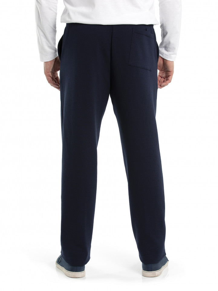 Revised Sentence: Rear view of a person wearing casual weekend attire, including a white long-sleeve shirt and Breakaway Snowy Mt Fleece Pants in navy blue. The person is also sporting slip-on shoes. One back pocket is visible on the right side of the fleece pants. The background is plain white.