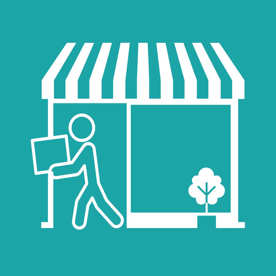 Icon of a small store with a striped awning on a teal background, representing the Pickup Instore service. A stick figure is carrying a box into the store, and there is a small tree next to the building.