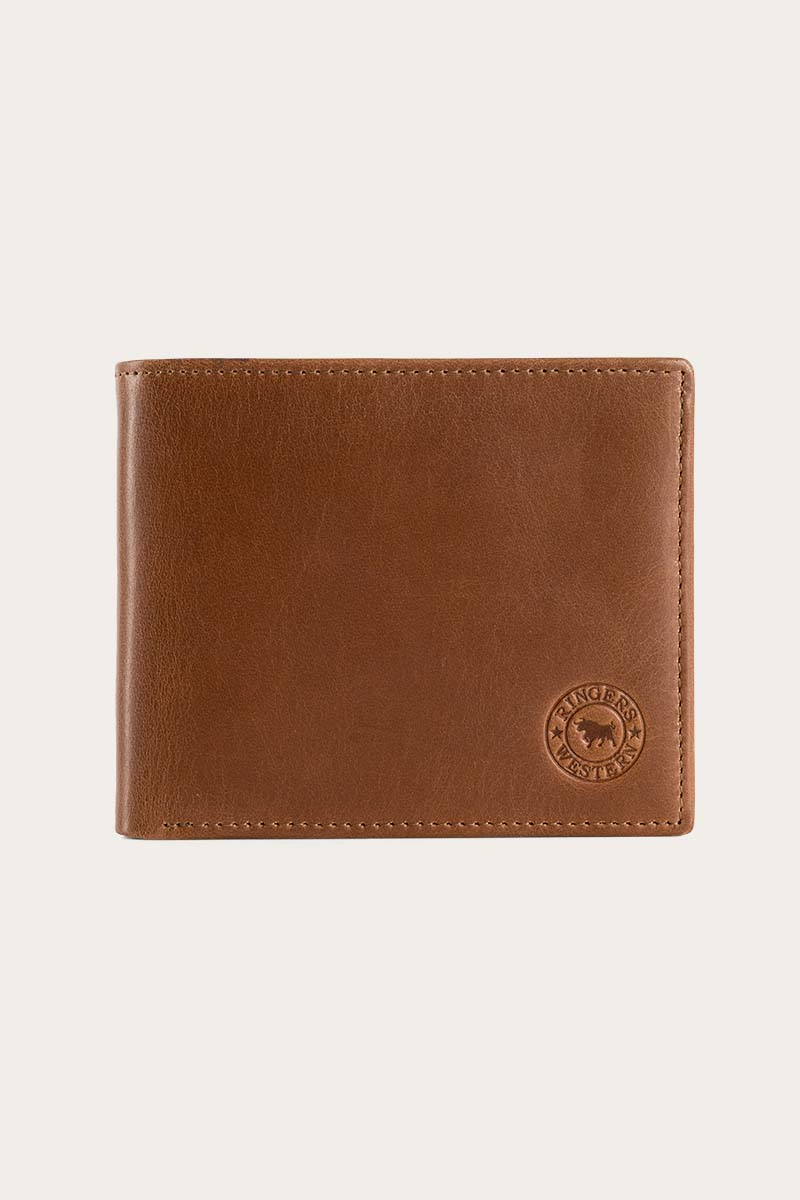 The Ringers Western Bayview Wallet, made from genuine leather, showcases a subtle embossed logo on the bottom right corner against a plain light background. This classic bifold design epitomizes the timeless elegance of Ringers Western craftsmanship.
