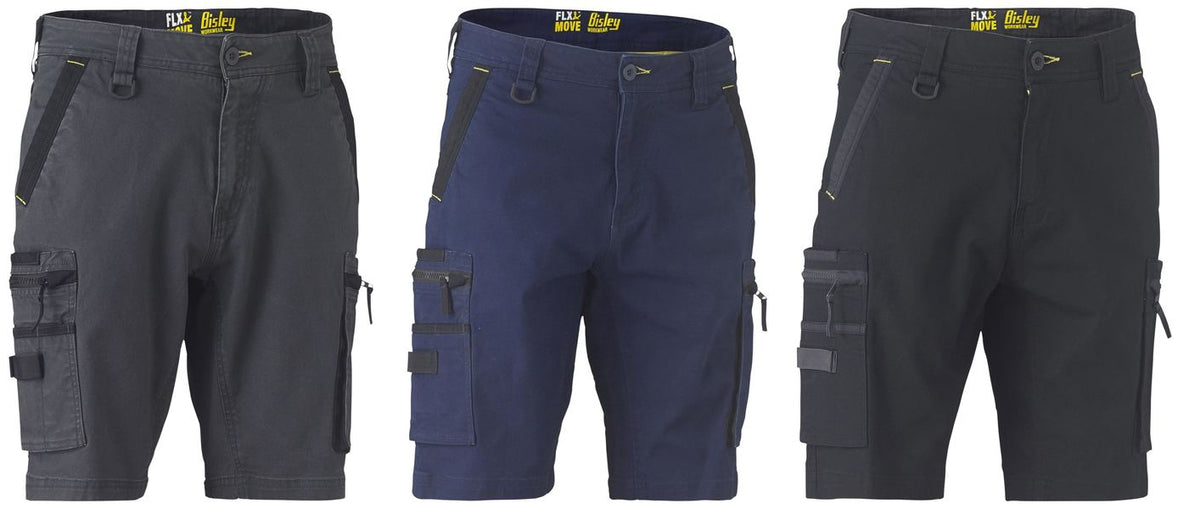 Three pairs of Bisley Flex & Move Stretch Utility Cargo Shorts displayed in a row. Each pair features multiple pockets, belt loops, and zippered pockets. The colors are dark gray, navy blue, and black. They have reinforced stitching and a rugged design suitable for heavy-duty use with reinforced belt loops for added durability.