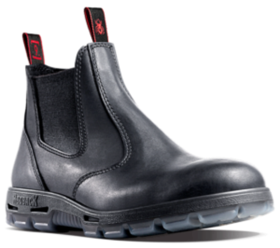 The Redback UBBK Bobcat Soft Toe is a black leather work boot with elastic sides and distinctive red pull tabs on the front and back. This handmade Australian boot features a soft toe, a black sole with a clear, textured bottom, and visible stitching along its body.