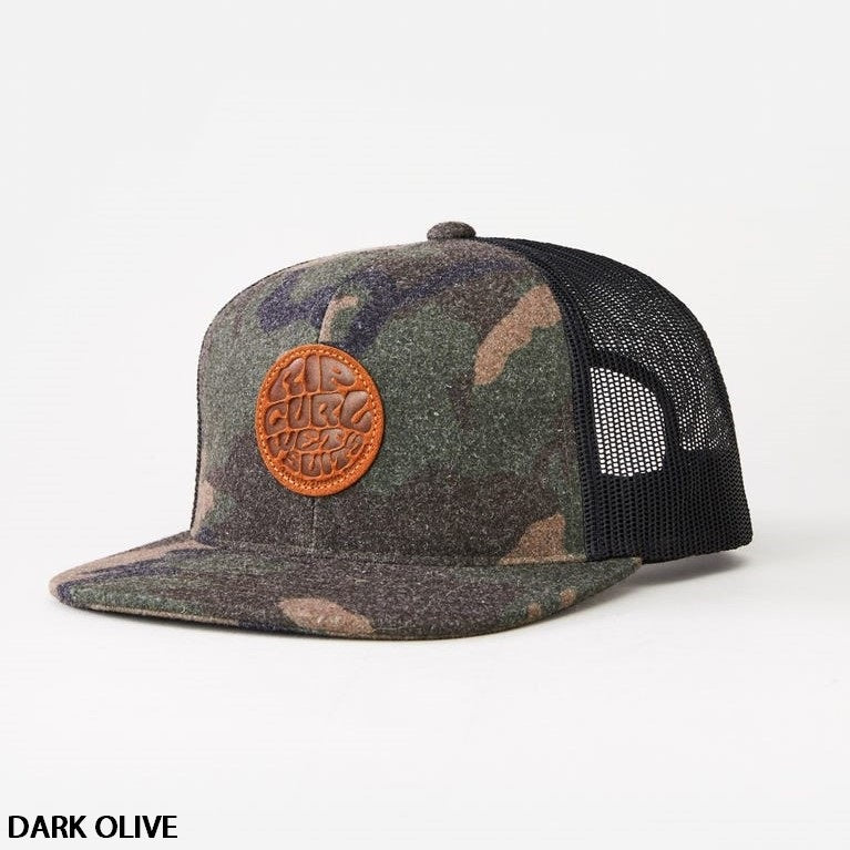 The Rip Curl Premium Wetty Trucker is a dark olive camouflage-patterned hat featuring a black mesh back and an orange circular patch on the front with embossed text and designs. It includes an adjustable strap for a perfect fit and is photographed against a plain white background. "DARK OLIVE" text appears in the bottom left corner.