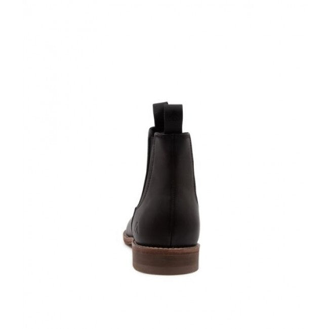Rear view of a single black Colorado Brumby Boot with a brown sole. The boot features elastic sides and a loop on the back, presumably for easy pulling on. The background is plain white.
