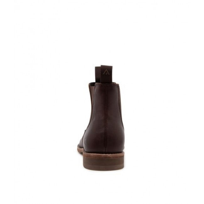 A single Colorado Brumby Boot, crafted from dark brown leather, is showcased from the back. The boot features a pull tab at the top of its shaft and has elastic sides. It also includes a rubber sole with a slight heel, demonstrating its well-constructed and sturdy build. The background is plain white.