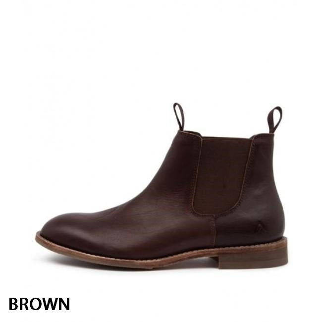 A single Colorado Brumby Boot with a smooth leather finish, elastic side panels, and pull tabs at the front and back for easy wearing. The boot has a tan-colored sole with light stitch detailing. The word "BROWN" is written in black at the bottom left corner.