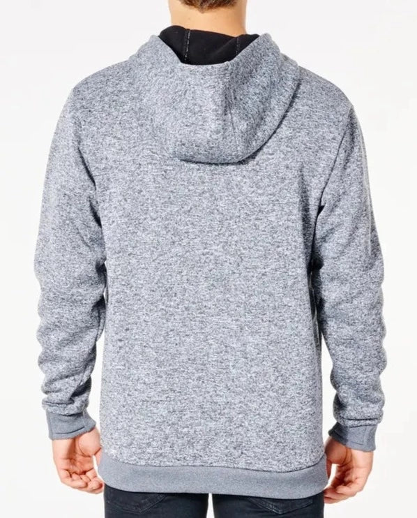 A person is seen from the back wearing a Rip Curl Anti Series Crescent Hood in light gray with a speckled texture, paired with dark pants. The hoodie combines style and durability effortlessly against a plain white background.