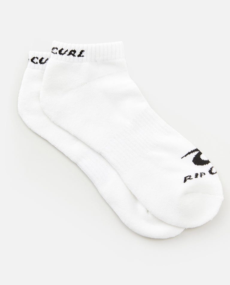 A pair of Rip Curl Corp Ankle Sock from the 5 Pack, in white with "RIP CURL" text and logo in black on the toe area, featuring arch support for added comfort. The socks are neatly laid out against a plain white background, positioned slightly overlapping each other.