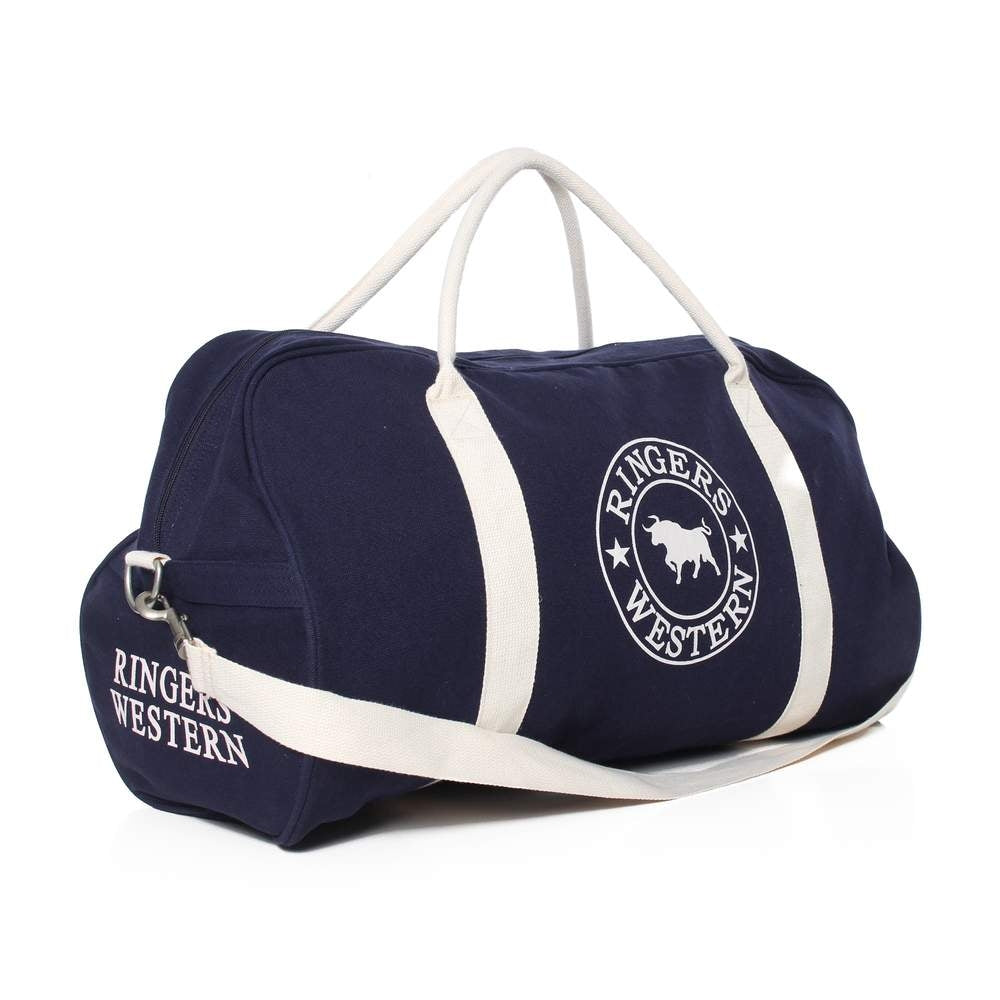 The Ringers Western Gundagai Duffle, a navy blue cotton canvas duffle bag with white accents and handles, is displayed. It showcases the "Ringers Western" logo on the side and end, featuring a circular design with a silhouette of a bull in the center. The bag also includes a white shoulder strap.