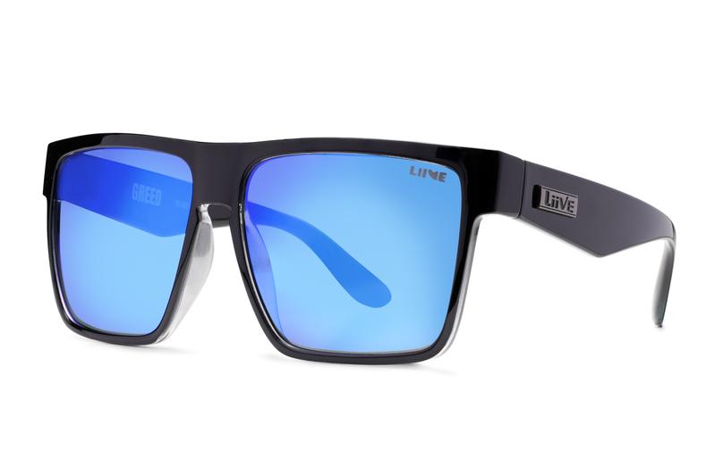 A pair of Liive Greed Mirror Sunglasses featuring black frames and large, reflective blue mirror finish lenses. The brand name "Liive" is visible on both the left lens and the left temple arm. With a thick bridge and wide temple arms, these sunglasses provide UV protection.