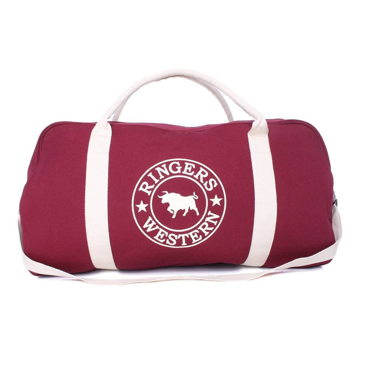 The Ringers Western Gundagai Duffle is a maroon cotton canvas duffle bag with white handles and a shoulder strap, adorned with a white circular logo showcasing a bull silhouette in the center and "Ringers Western" text encircling it.