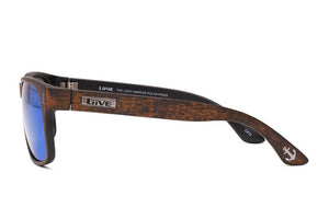 Side view of Liive The Lewy Mirror Polar Sunglasses featuring faux wood grain arms, a "Liive" metallic detail, and an engraved anchor on the temple tip. The blue-tint mirrored lenses offer UV protection, making them both stylish and functional.