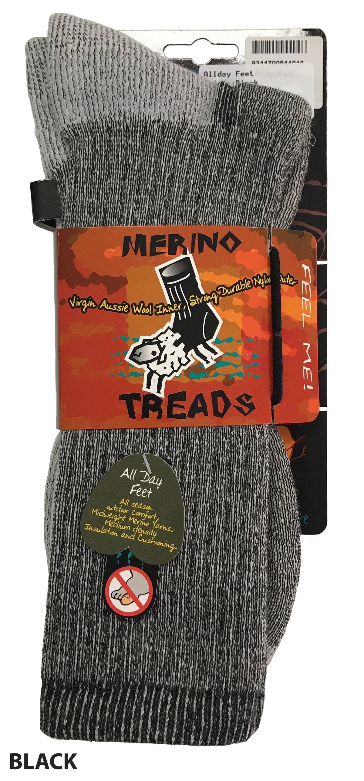 A pair of black and grey Merino Treads Allday Feet socks is displayed in packaging. The packaging label highlights the sock's features like "Virgin Aussie Wool," "Strong & Durable," and "All Day Feet Comfort." A "Feel Me!" label invites tactile interaction, making these perfect as outdoor everyday socks.