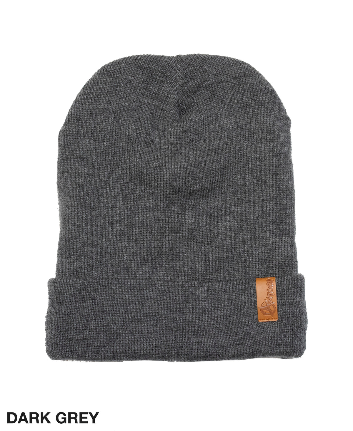 The Anticorp Merino Lined Beanie is a dark grey knit hat with a folded brim and a brown leather patch on the front, designed for warmth and style. "DARK GREY" appears in the bottom left corner.