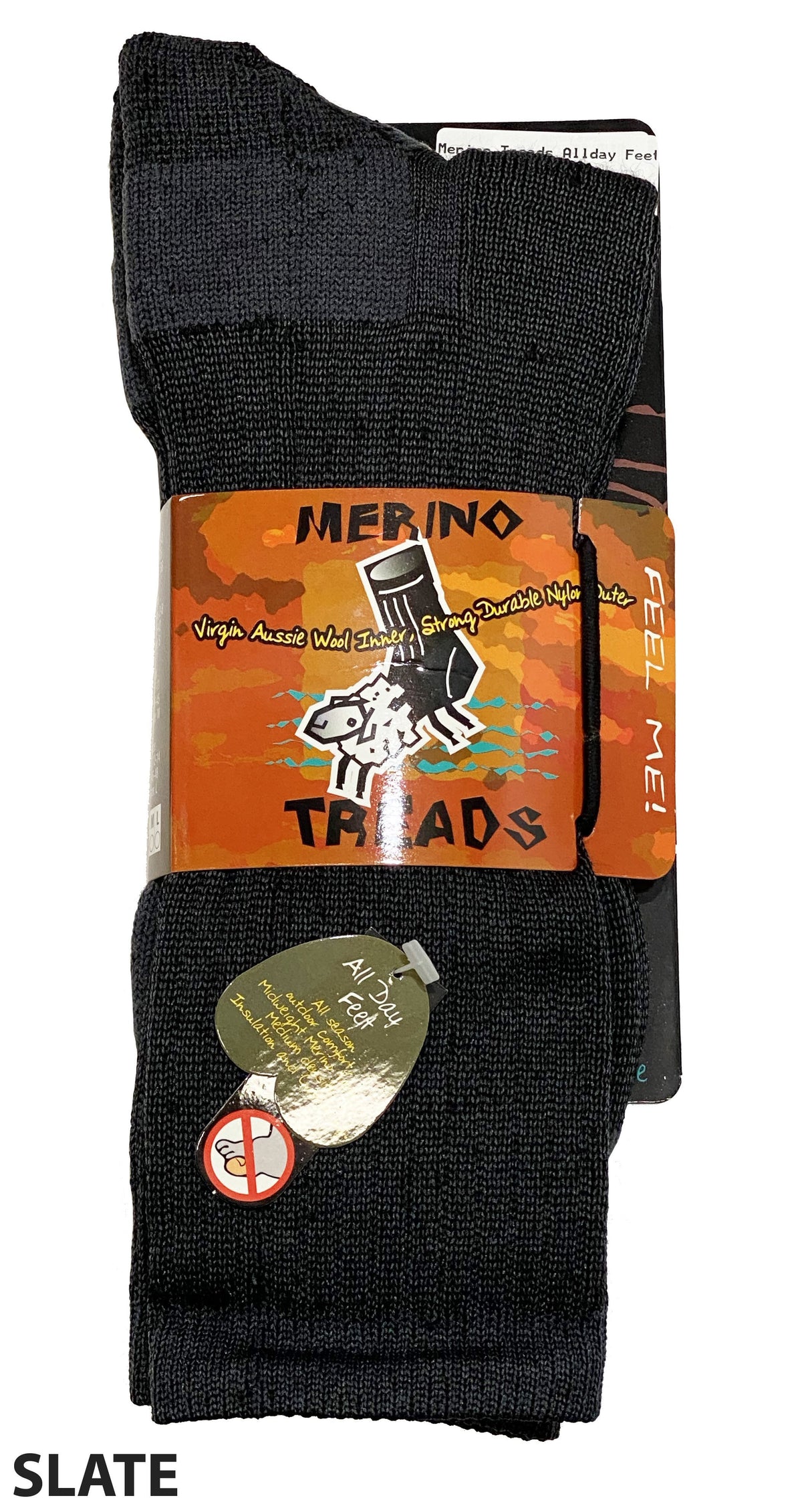 A pair of dark-colored socks labeled "Merino Treads Allday Feet" is shown in the image. The packaging features a sheep with sunglasses and headphones. These winter work socks are promoted as strong, durable, and made from virgin Aussie wool. A small tag reads "All in our threads.