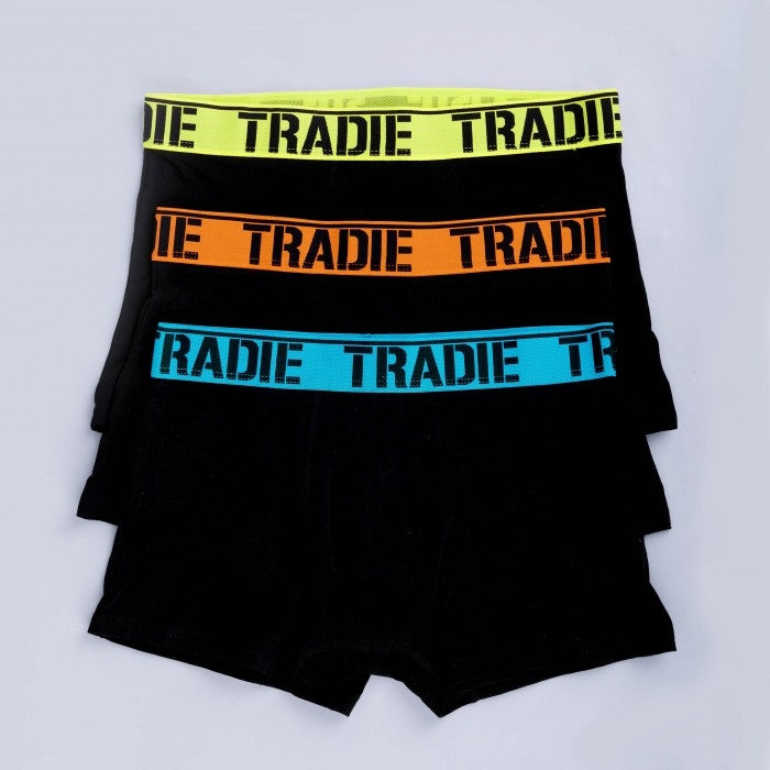 Three pairs of black Tradie Men's 3PK Trunks are stacked. The top pair has a neon yellow waistband, the middle pair has an orange waistband, and the bottom pair has a blue waistband. Each comfortable fit waistband features the word "TRADIE" in bold black letters, crafted from a Cotton/Elastane blend.