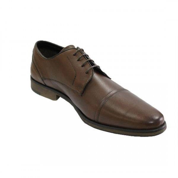 Introducing the One4TheRoad Harrison Shoe: a single brown leather masterpiece with a cap toe design, featuring a lace-up closure and low heel. It boasts a sleek, polished appearance, slightly pointed toe, and synthetic lining for added comfort.